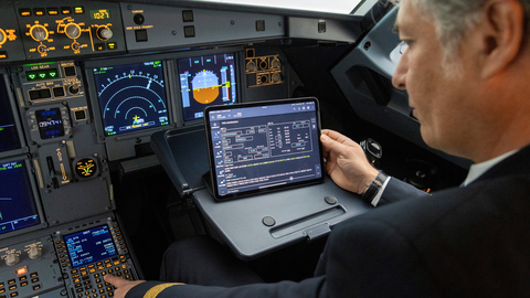 A pilot using the Navigation+ solution in the cockpit  