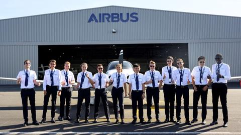 Airbus Flight Academy cadets outdoors thumbs up Airbus Flight Academy cadets outdoors thumbs up