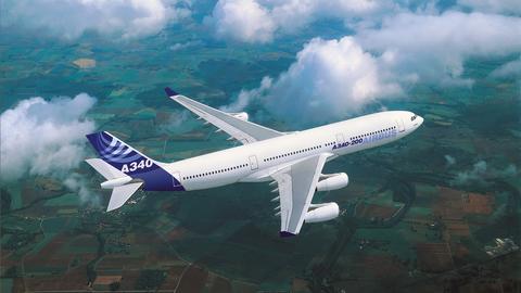 A340 in flight over fields, with Airbus livery A340 in flight over fields, with Airbus livery