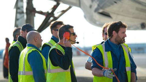 Maintenance workers on ground