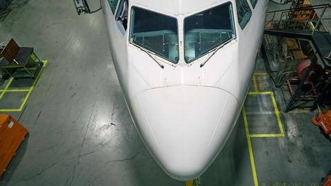 Satair-aircraft in hangar-zoom on cockpit