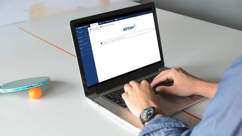 User on their laptop using airnavX