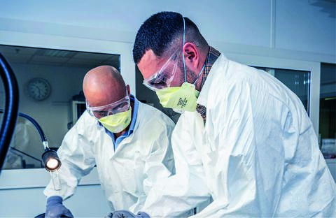 Two technicians engaging in structure aircraft training by working on a part of an aircraft frame