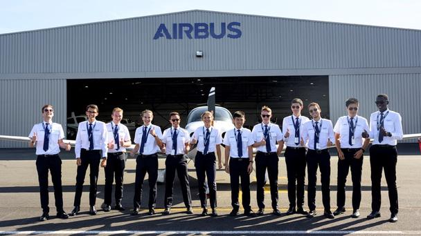 Airbus Flight Academy cadets outdoors thumbs up Airbus Flight Academy cadets outdoors thumbs up