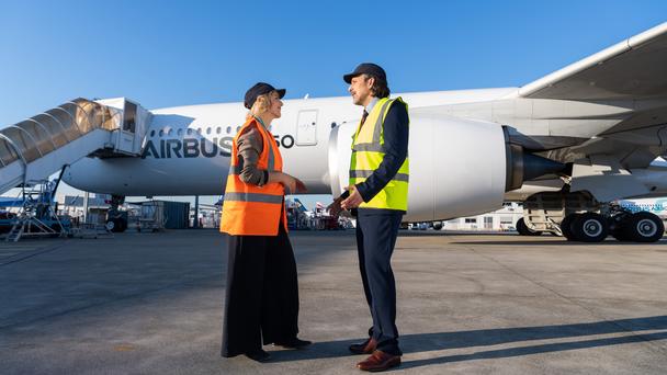 People talking in front of A350 People talking in front of A350
