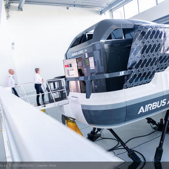 Pilot trainees stepping into a full flight simulator as part of their flight training course.
