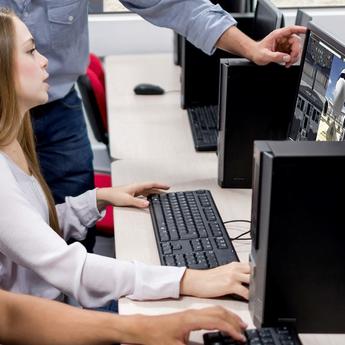 Students engaged in a maintenance training course under the guidance of an instructor in a classroom