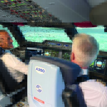 Two pilots in a flight simulator
