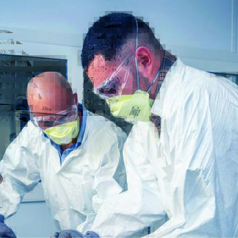 Two technicians engaging in structure aircraft training by working on a part of an aircraft frame