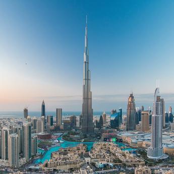 Dubai skyline view from the sky with the Burj Khalifa tower in the center during daytime
