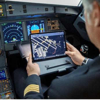 A pilot checking the solution in the cockpit