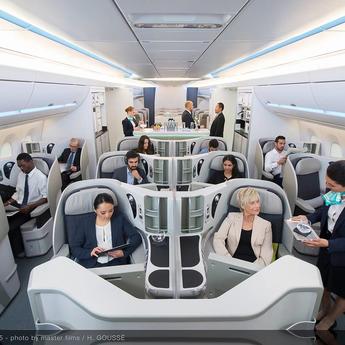 Interior view of an aircraft cabin with passengers comfortably seated