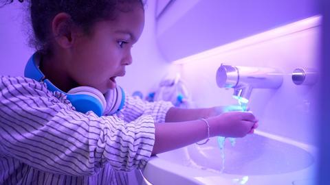 Touchless features used by child in A330neo Airspace cabin