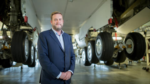Portrait of Richard Stoddart underneath a plane