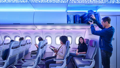 A320 Airspace Cabin - man loading lugagge to XL Bin