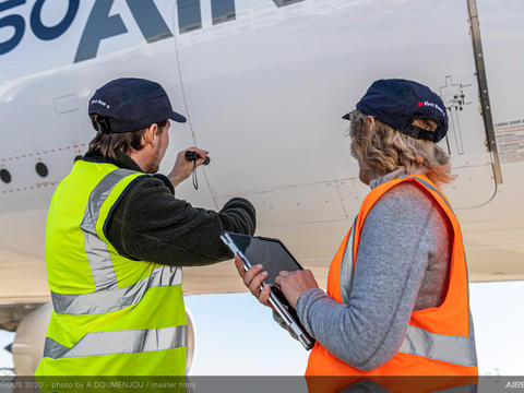 Two people working in front of A350