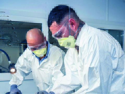 Two technicians engaging in structure aircraft training by working on a part of an aircraft frame
