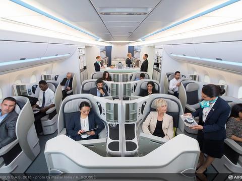 Interior view of an aircraft cabin with passengers comfortably seated