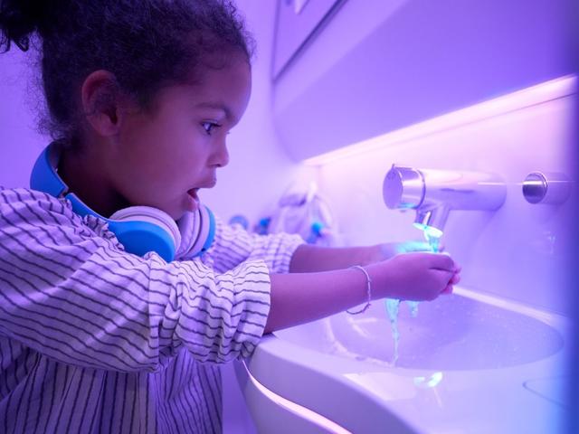 Touchless features used by child in A330neo Airspace cabin