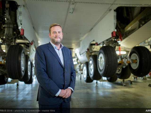 Portrait of Richard Stoddart underneath a plane