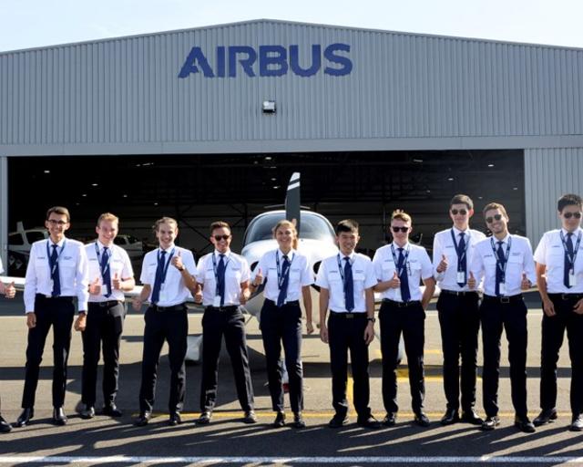 Airbus Flight Academy cadets outdoors thumbs up Airbus Flight Academy cadets outdoors thumbs up