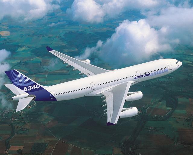 A340 in flight over fields, with Airbus livery A340 in flight over fields, with Airbus livery