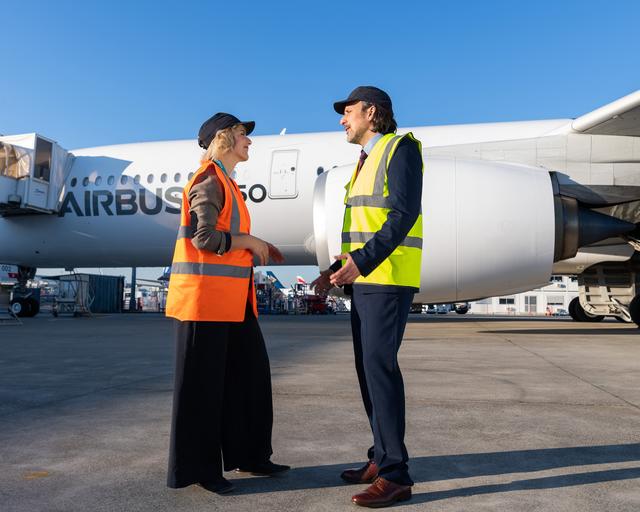 People talking in front of A350 People talking in front of A350