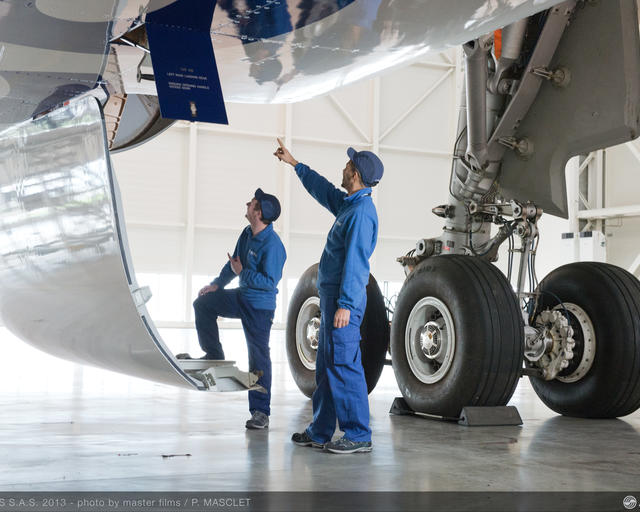 Maintenance technicians checking an aircraft to ensure operational safety. Maintenance technicians checking an aircraft to ensure operational safety.