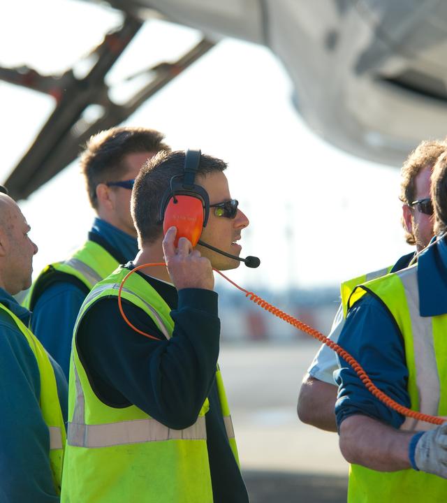 Maintenance workers on ground