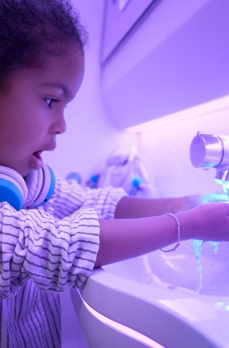 Touchless features used by child in A330neo Airspace cabin