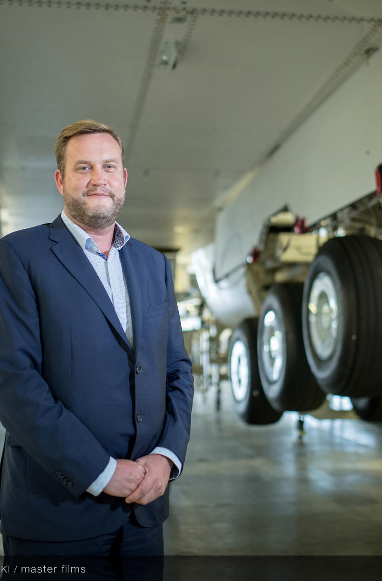 Portrait of Richard Stoddart underneath a plane