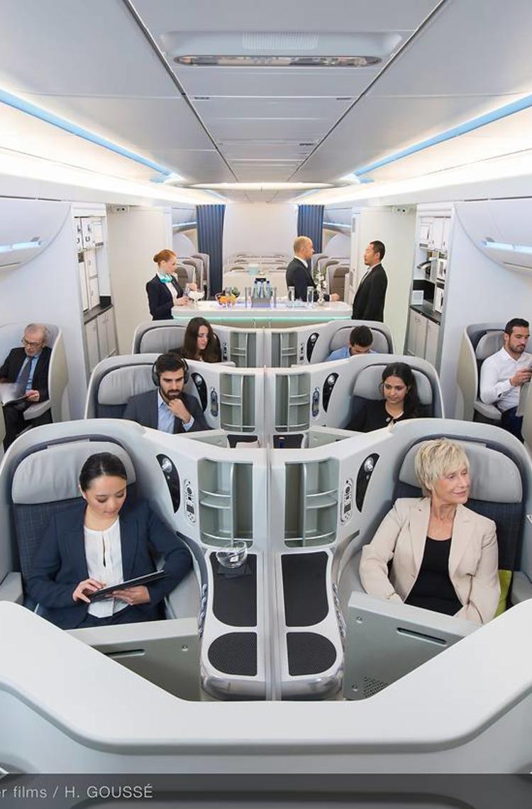 Interior view of an aircraft cabin with passengers comfortably seated